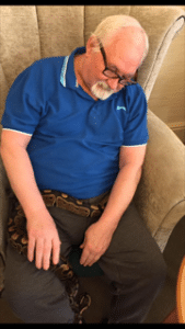 Animal-therapy-resident-holding-snake