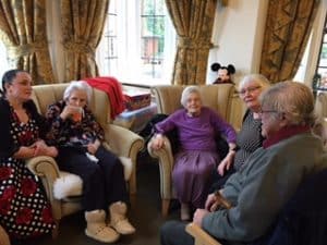 group of resident chatting at KEMP Hospice fundraiser