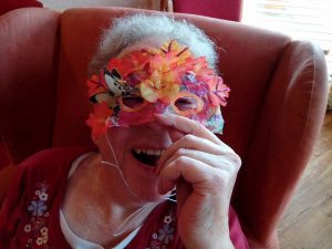 resident showing her vintage autumn mask