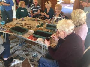 Planting seed trays at the dementia cafe