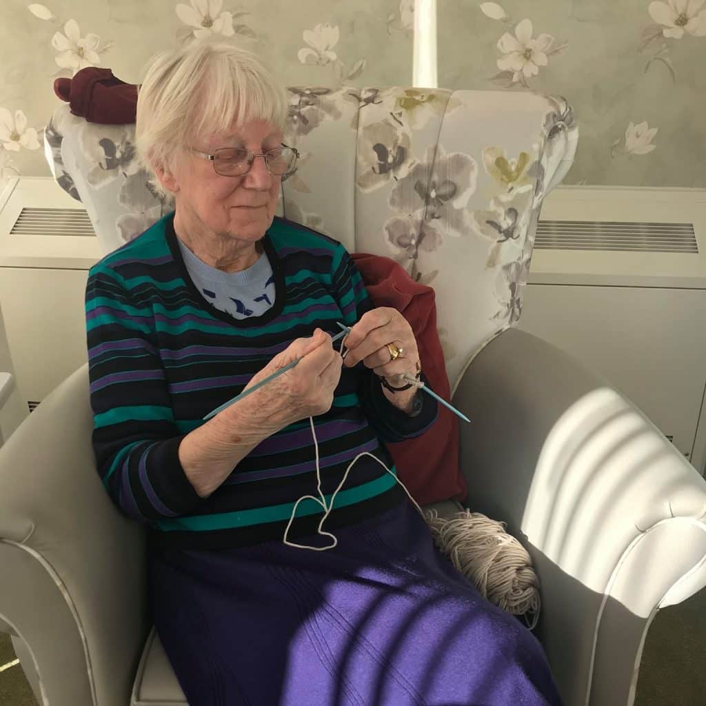 Lady resident knitting - Newstead