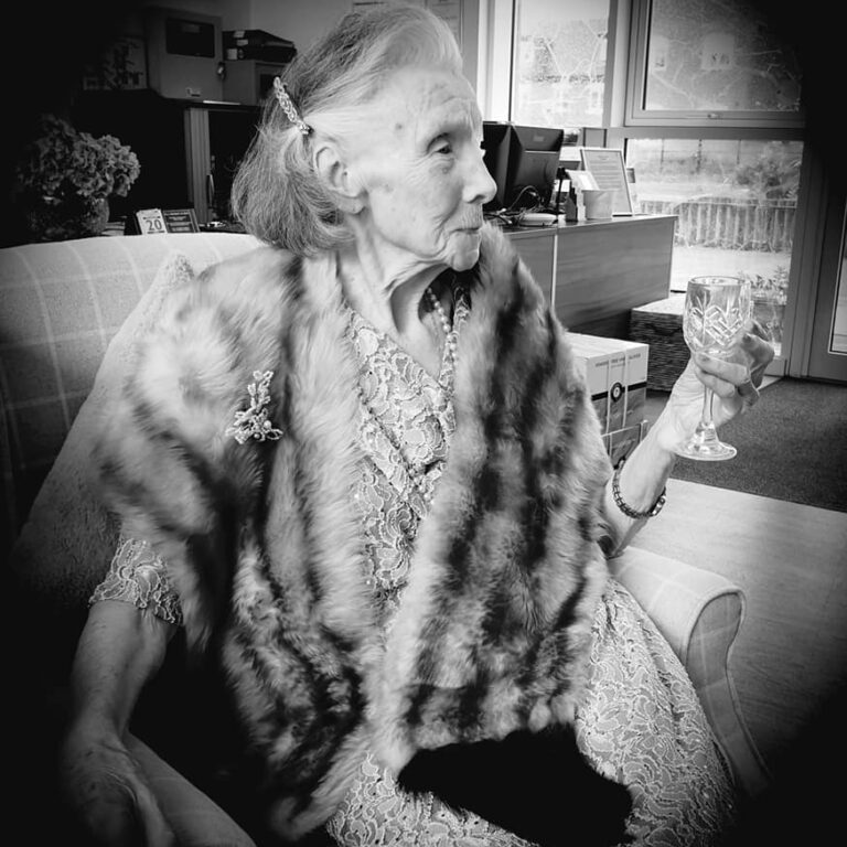 Glitz and glamour - lady in fur stole - Cannes day - b/w