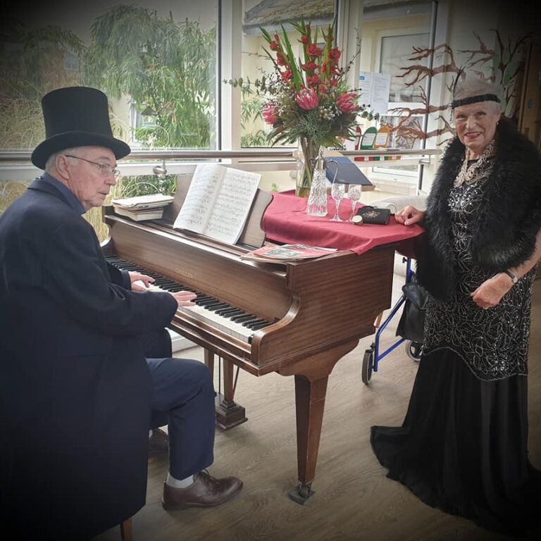 playing the piano and singing - glitz and glamour at The Lawns