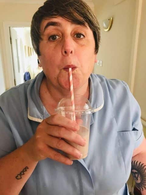 nurse drinking fruit smoothie