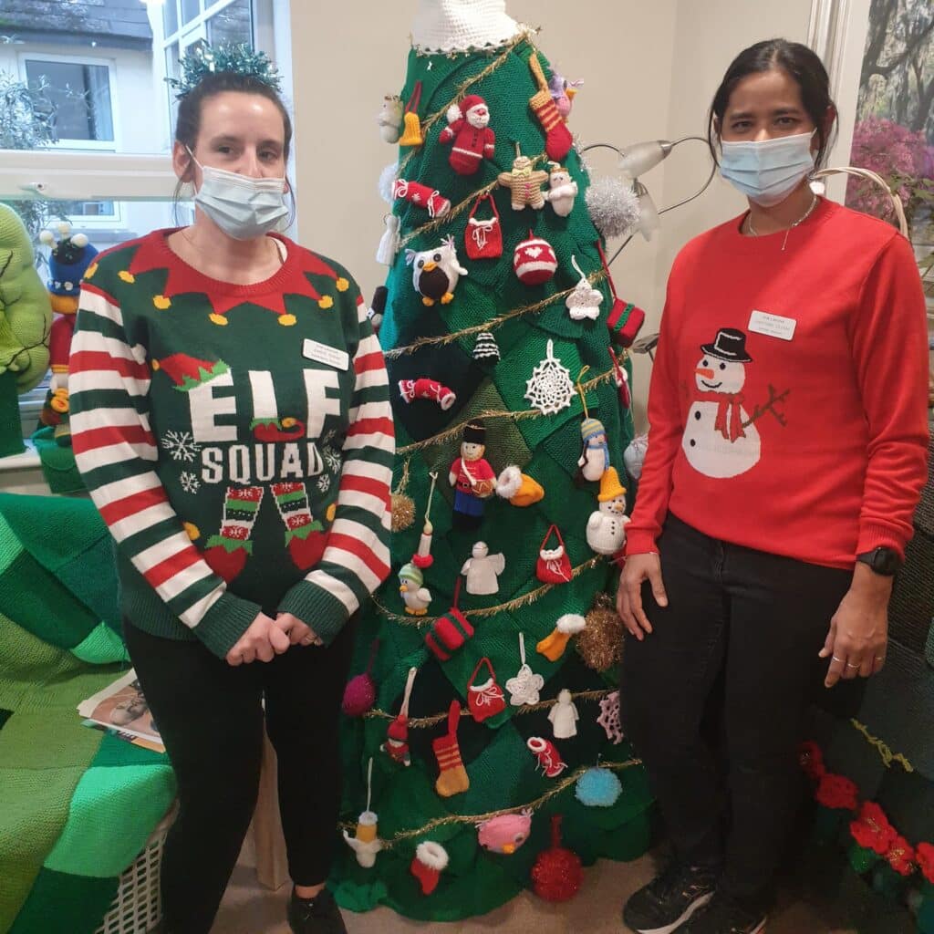 Elf Day - two of the team with the Christmas tree