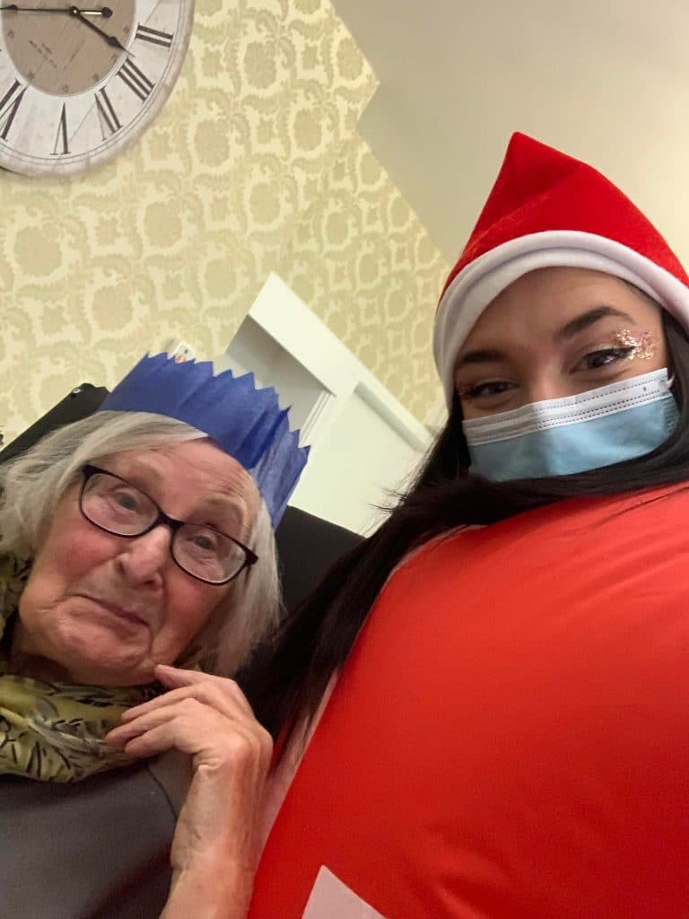 lady resident with inflatable santa - festive fun