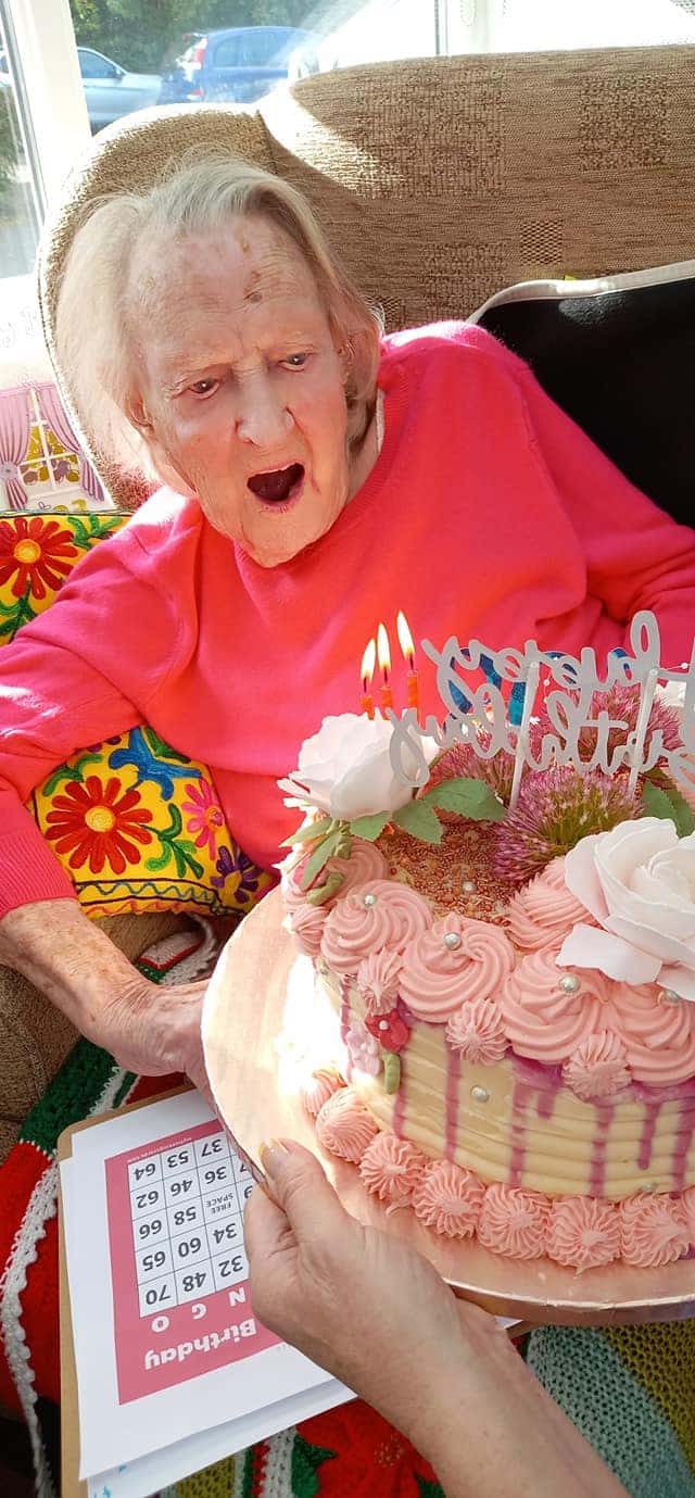Edna blowing out her birthday candles 103 years old
