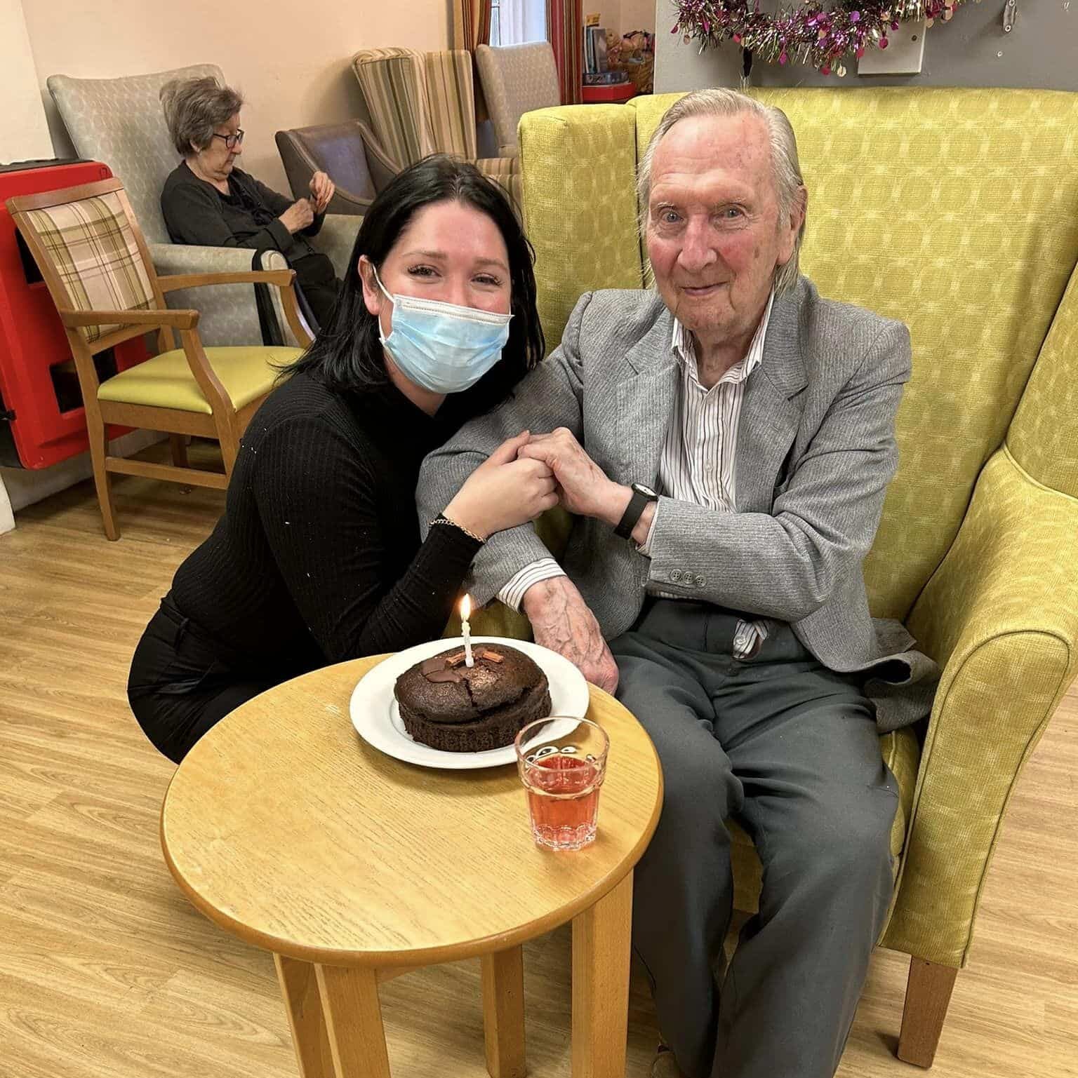 birthday celebrations - Hayley and gentleman with cake