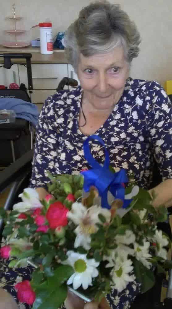Coronation floristry lady in navy floral dress