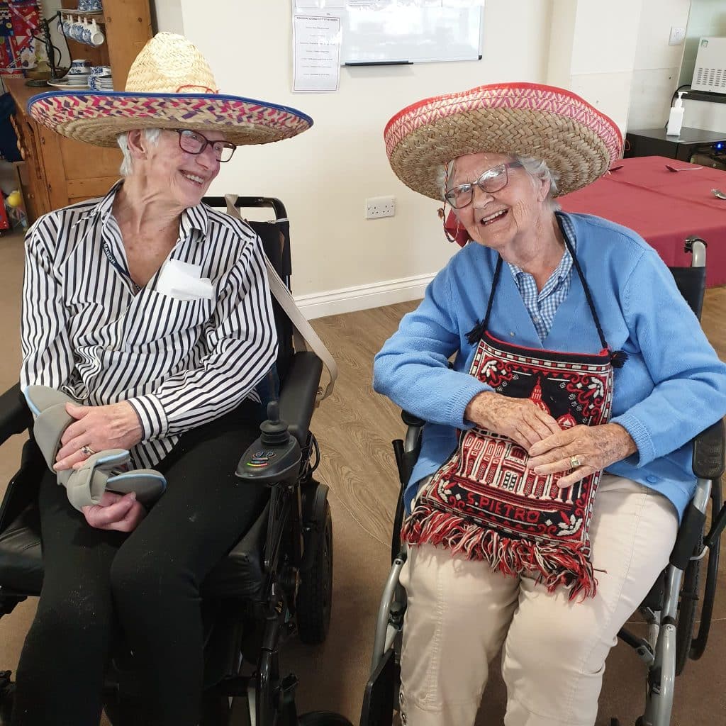 Mexican Day - two lady residents smiling together